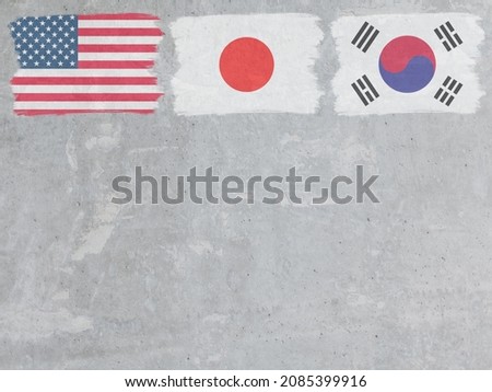 Concrete wall painted with Japan,USA and Korea flags with a dry 