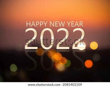 Merry Christmas and happy new year 2022 concept. white gradient text and number on bright night bokeh background. new modern luxury design card for celebration party in holidays.