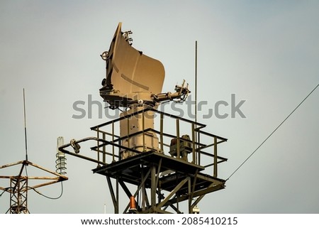 Coast guard radar station against the blue sky. Marine safety monitoring. Royalty-Free Stock Photo #2085410215