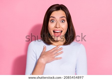 Photo of shocked excited young woman wear white sweater open mouth arm chest shopping sale isolated pink color background