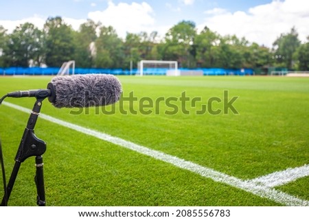 directional microphone on a football field to record sound when broadcasting for TV