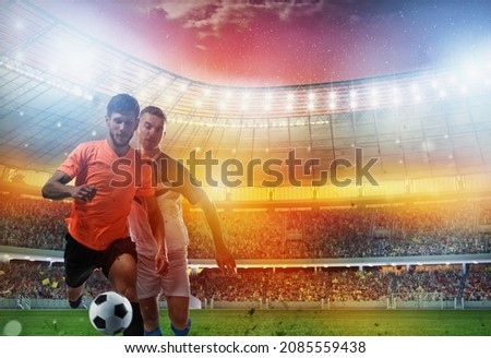 Soccer players play with soccerbal at the stadium