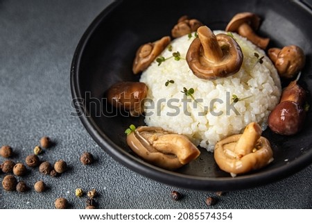 rice mushrooms risotto second course meal snack on the table copy space food background rustic veggie vegan or vegetarian food no meat