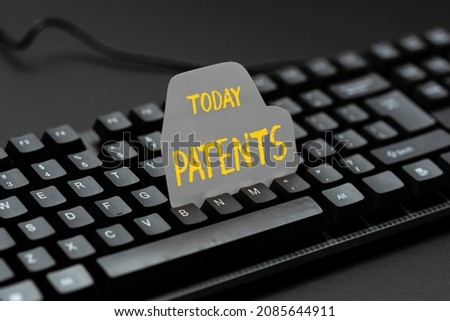 Hand writing sign Patents. Business idea government authority or licence conferring a right or title Converting Written Notes To Digital Data, Typing Important Coding Files