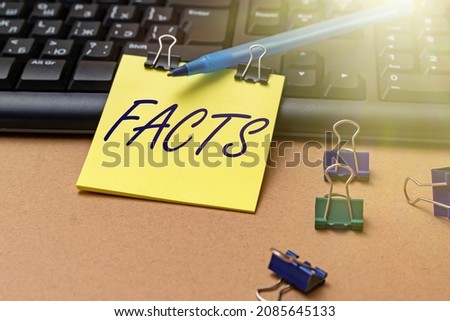 Text caption presenting Facts. Word for information used as evidence or part of report news article blog Multiple Assorted Collection Office Stationery Photo Placed Over Table