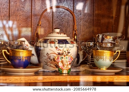 In a cupboard there is china  Royalty-Free Stock Photo #2085664978