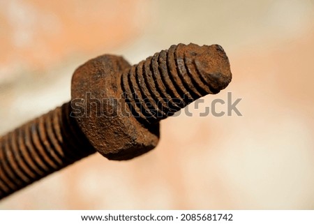 old rusty bolt, iron rod with screw threads. Rusted mechanical components. threaded bolt and nut isolated close up. dismantling concept, difficult to unscrew, non-removable. selective focus