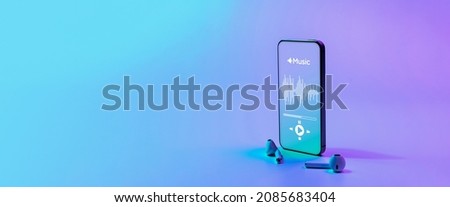 Music banner. Mobile smartphone screen with music application, sound headphones. Audio voice with radio beats on neon gradient background. Broadcast media music banner with copy space Royalty-Free Stock Photo #2085683404