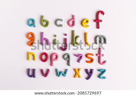 letters of the English alphabet made of multicolored plasticine on a white background Royalty-Free Stock Photo #2085729697
