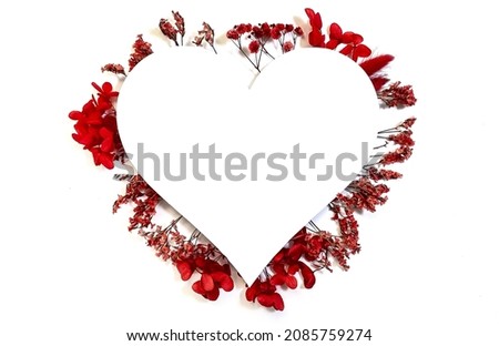 Flowers composition from red flowers in the form of a heart on white background. Spring, summer template for your projects