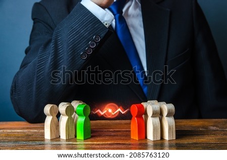 Businessman leader is thinking about resolving conflict of people groups. Rivalry and competition. Resolution, compromise through negotiations. Reconciliation and Consolidation. Mediator, mediation. Royalty-Free Stock Photo #2085763120