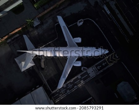 Overhead shot of Plane in the City