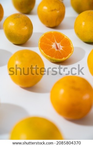 Group of orange isolated on white background.sliced orange. Vertical picture. Studio lighting. Shallow depth of field