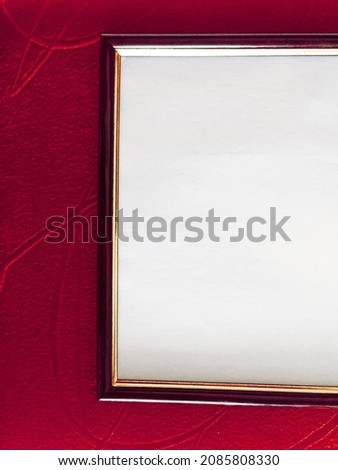 Blank picture frame detail on red background, luxury home decor and interior design, poster print and printable art mockup.
