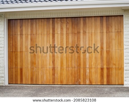 View of wooden roller garage door. Copy space stock photo.