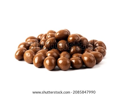 Chocolate balls filled on a white background. Chocolate candy balls with crisp filling isolated on white background Royalty-Free Stock Photo #2085847990