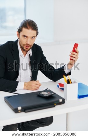 office worker office work documents with a phone in hand Lifestyle