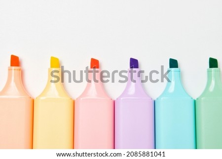 Colorful marker pen on white background. Multi-colored highlighter, close-up Royalty-Free Stock Photo #2085881041