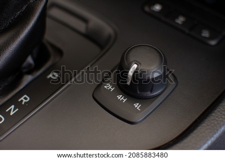 Two-wheel and four-wheel drive system adjustment knobs for off-road. Technology for driving comfort Royalty-Free Stock Photo #2085883480