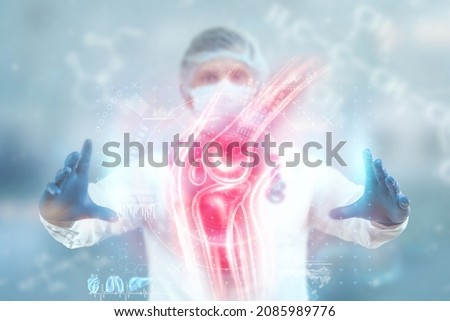 Joint pain, the doctor looks at the hologram of the knee joint. X-ray image, trauma, rheumatologist consultation, skeletal image, medical concept, medical technologies of the future Royalty-Free Stock Photo #2085989776