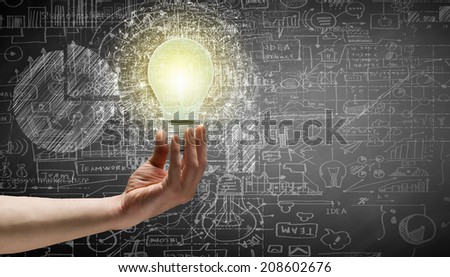 Conceptual image with light bulb diagrams and graphs