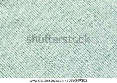 Soft light green ribbed melange cotton fabric texture or background Royalty-Free Stock Photo #2086049302