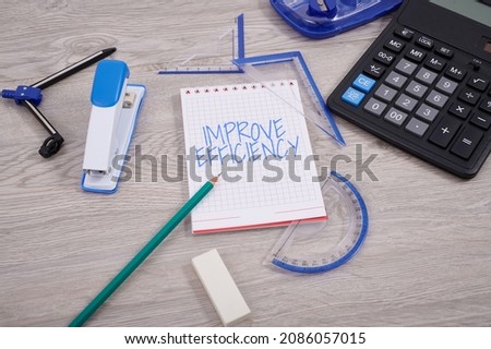 Text showing inspiration Improve Efficiency. Business overview Competency in performance with Least Waste of Effort Blank Notebook Page With A Calculator And Geometric Stationery Over Table. Royalty-Free Stock Photo #2086057015