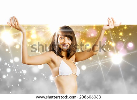 Young bikini girl holding white blank banner. Place for text