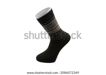 Clothes made of socks, knitwear. Many colorful socks in the form of a panorama. Socks of different sizes for cold seasons. Clothing for autumn and winter. Knitted socks on a white background.