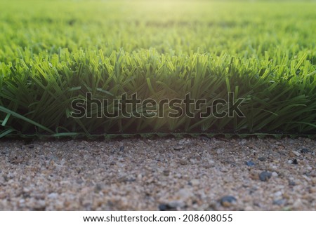 field,artificial green grass,sand ground