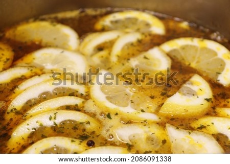 Chicken soup with lemon in a saucepan. Greek recipe
