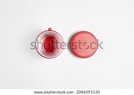 Plastic folding travel glass with lid  isolated on white background.High resolution photo.Top view. Mock-up.