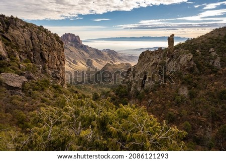 Boot Canyon with Wafting Clouds in the Valleys Below in Big Bend National Park Royalty-Free Stock Photo #2086121293