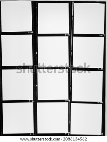real flat bed scan of black and white hand copy contact sheet with 12 empty film frames. 120mm film photo placeholder. Royalty-Free Stock Photo #2086134562