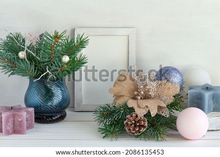 Christmas decoration, frame mockup, bouquet of fir on a white table, copy space
