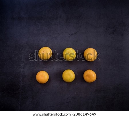 healthy eating. ripe yellow tangerines on a dark background. place for text. christmas mood