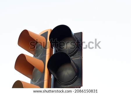 Unlit traffic light. Pedestrian crossing without active light. Traffic lights on white background. Traffic light not working and copy space. Traffic problem at intersections. Royalty-Free Stock Photo #2086150831