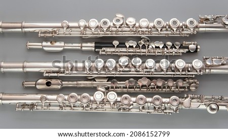 musical instruments are laid out on a gray surface  Royalty-Free Stock Photo #2086152799