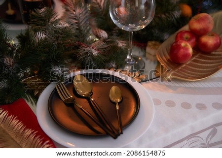 Christmas table. View of gilded table objects. Beautiful picture