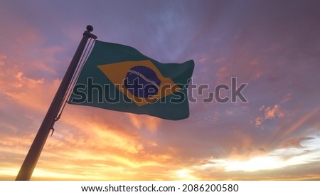 Brazil Flag on a Pole with Sunset Sky Evening Background Brazilian Royalty-Free Stock Photo #2086200580