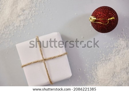 A studio photo of a white christmas present