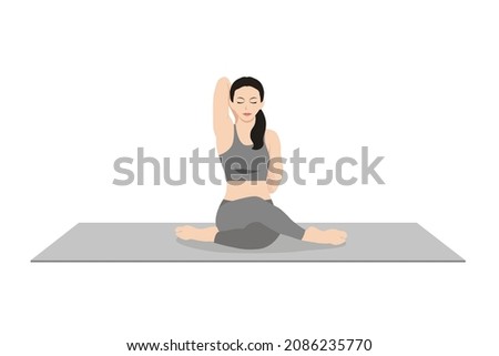 Cow Face Pose, Beautiful girl practice Gomukhasana. Young attractive woman practicing yoga exercise. working out, black wearing sportswear, grey pants and top, indoor full length, calmness and relax.