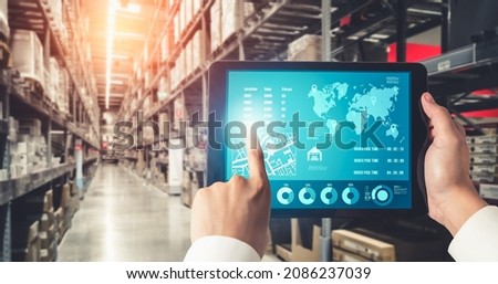 Warehouse management innovative software in computer for real time monitoring of goods package delivery . Computer screen showing smart inventory dashboard for storage and supply chain distribution . Royalty-Free Stock Photo #2086237039