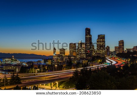 Skyline Seattle with traffic on the Freeway at Night