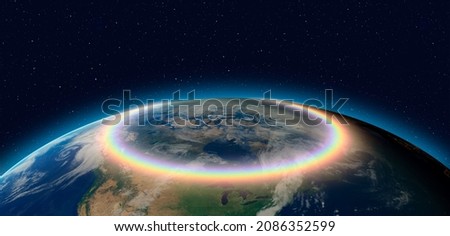Earth day concept - Rainbow surrounds the Planet Earth "Elements of this Image Furnished by NASA"