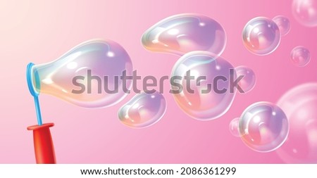 Blowing soap bubbles. Realistic childish play. Flying isolated transparency balls. Blow ring and shampoo iridescent rainbow light 3D spheres. Baby game with foamy liquid Royalty-Free Stock Photo #2086361299