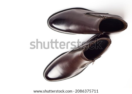 New brown men's shoes isolated on white background. Pair of men's shoes. Top view, flat lay.