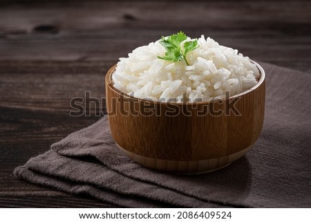 Bowl with cooked rice on the table. Royalty-Free Stock Photo #2086409524