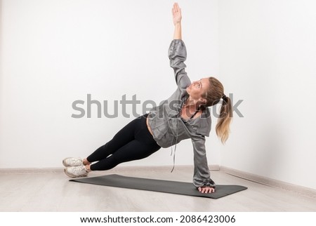 Young beautiful woman practicing yoga. Wellness concept. Calmness and relax, woman happiness.