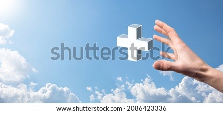 Hand hold 3D plus icon, man hold in hand offer positive thing such as profit, benefits, development, CSR represented by plus sign.The hand shows the plus sign.
